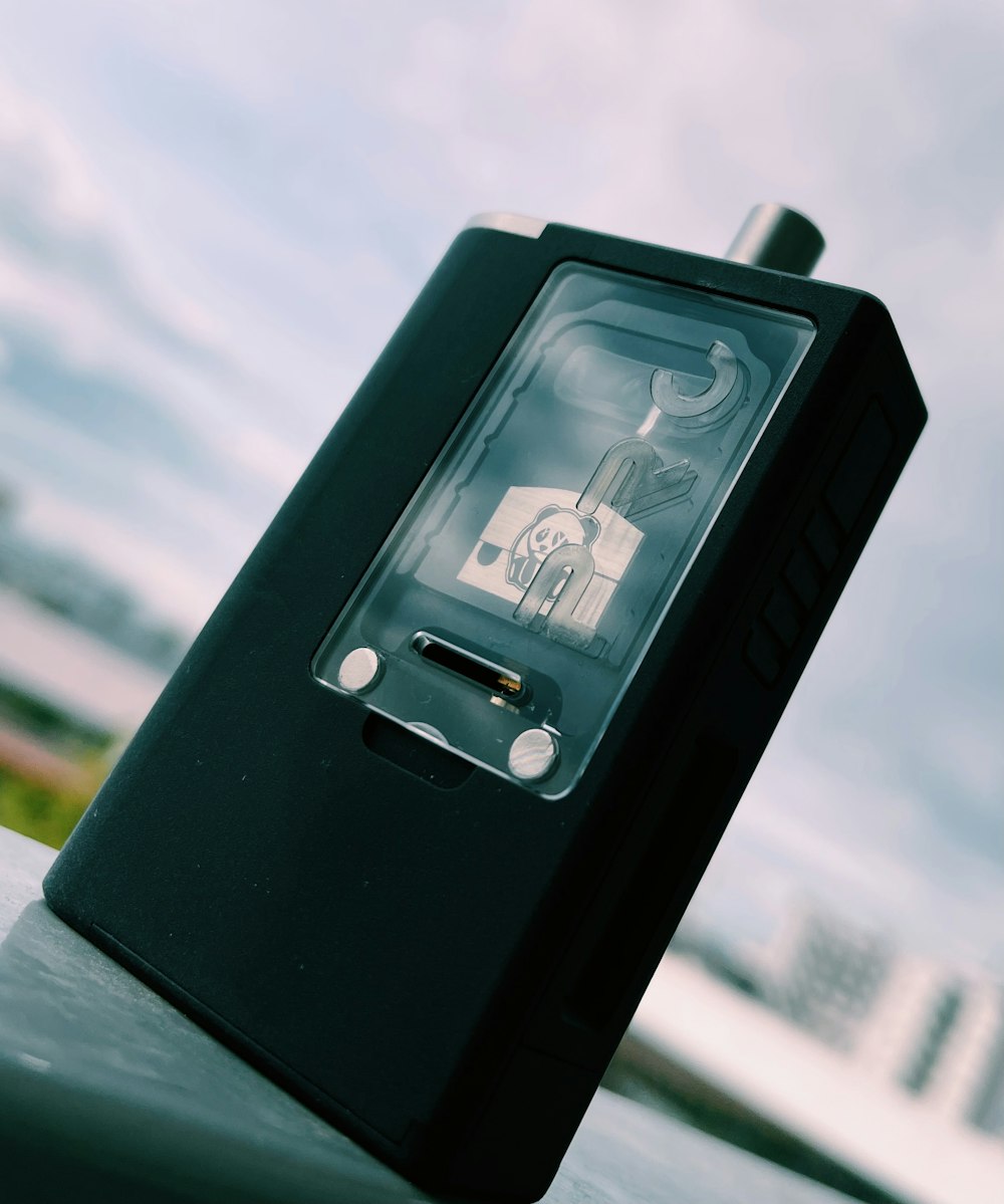 a black electronic device sitting on top of a table