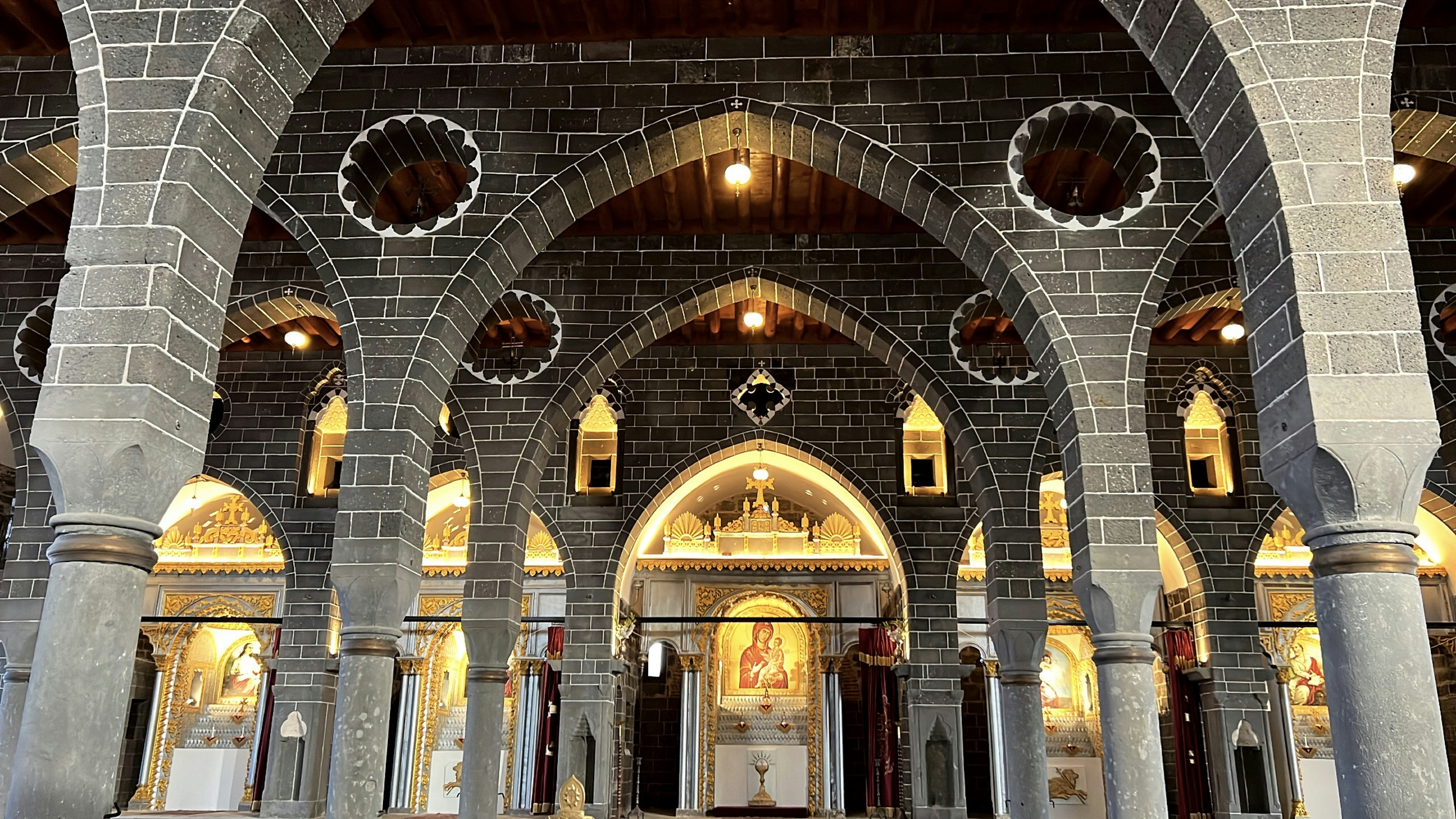 a church with arches and a clock on the wall