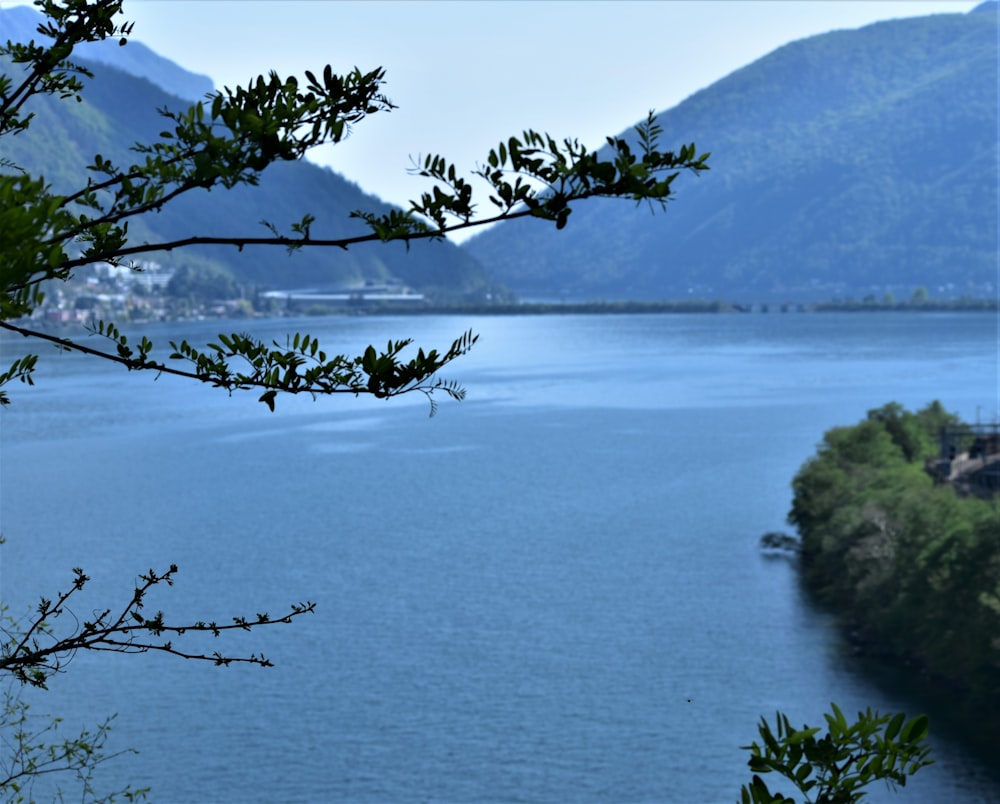 a view of a body of water with mountains in the background