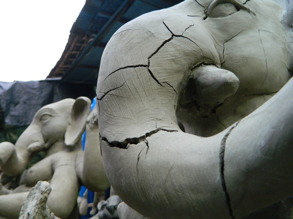 a close up of a statue of elephants