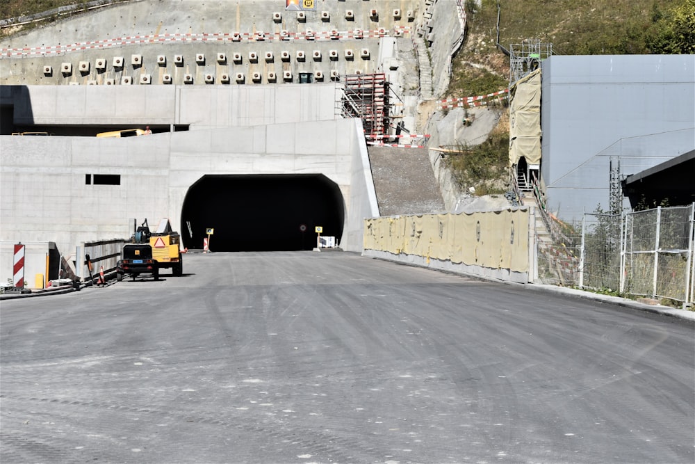 a construction area with a tunnel and construction equipment
