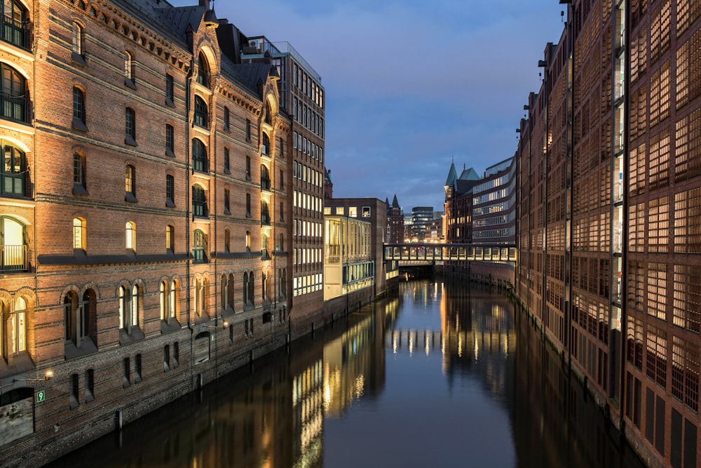 a river running through a city next to tall buildings