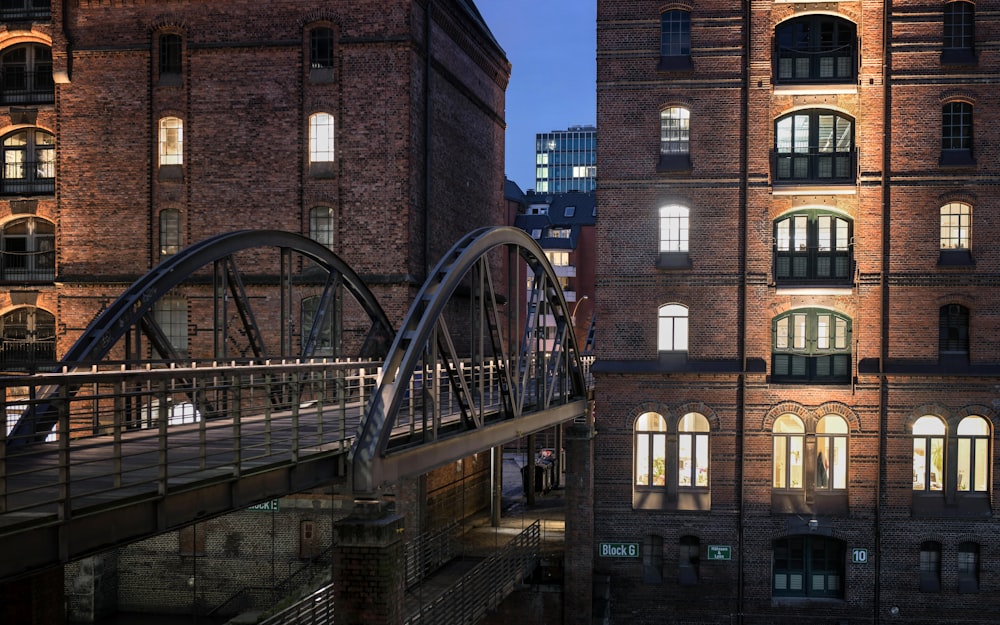 a bridge over a river next to tall buildings