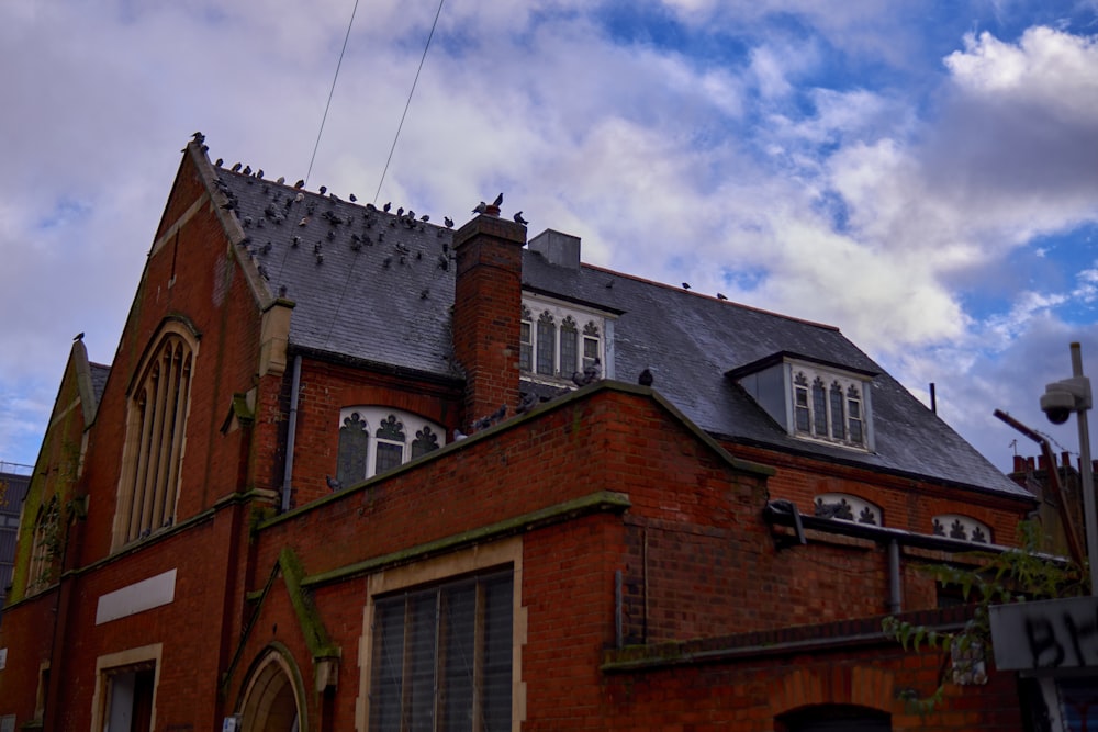 a red brick building with a gray roof