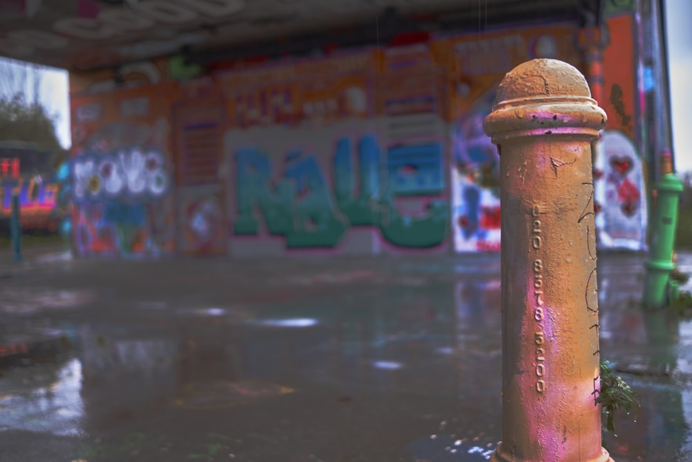 a yellow fire hydrant sitting in the middle of a street