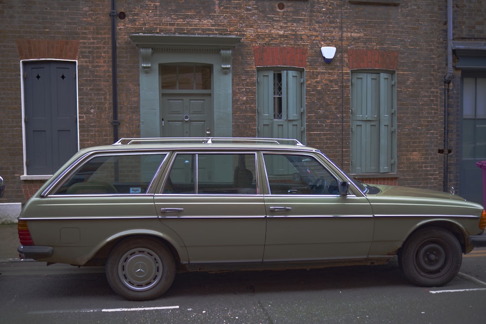 a car parked in front of a brick building