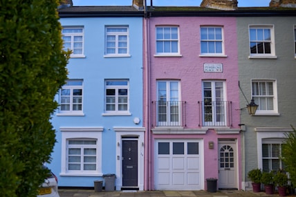 a row of multi - colored houses in a residential area