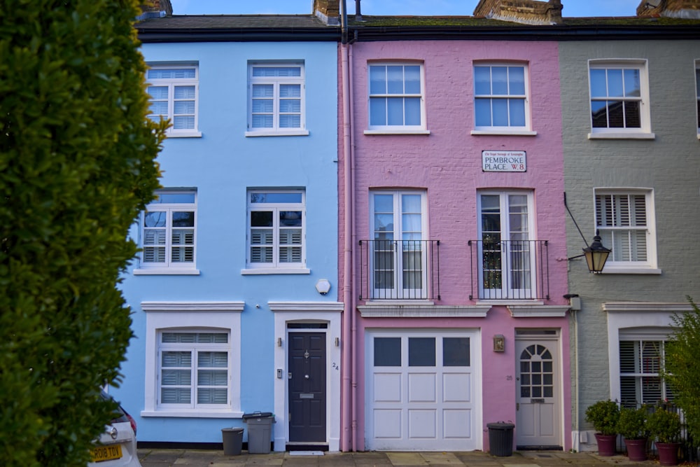 a row of multi - colored houses in a residential area