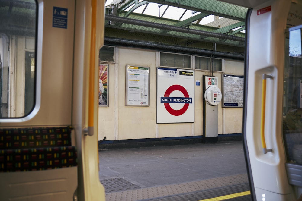 a view of a train station from inside the train