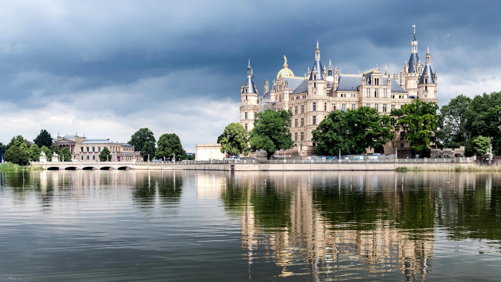 a large castle sitting on top of a lake