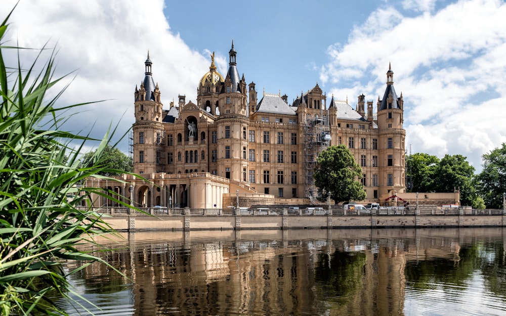 a large building sitting next to a body of water