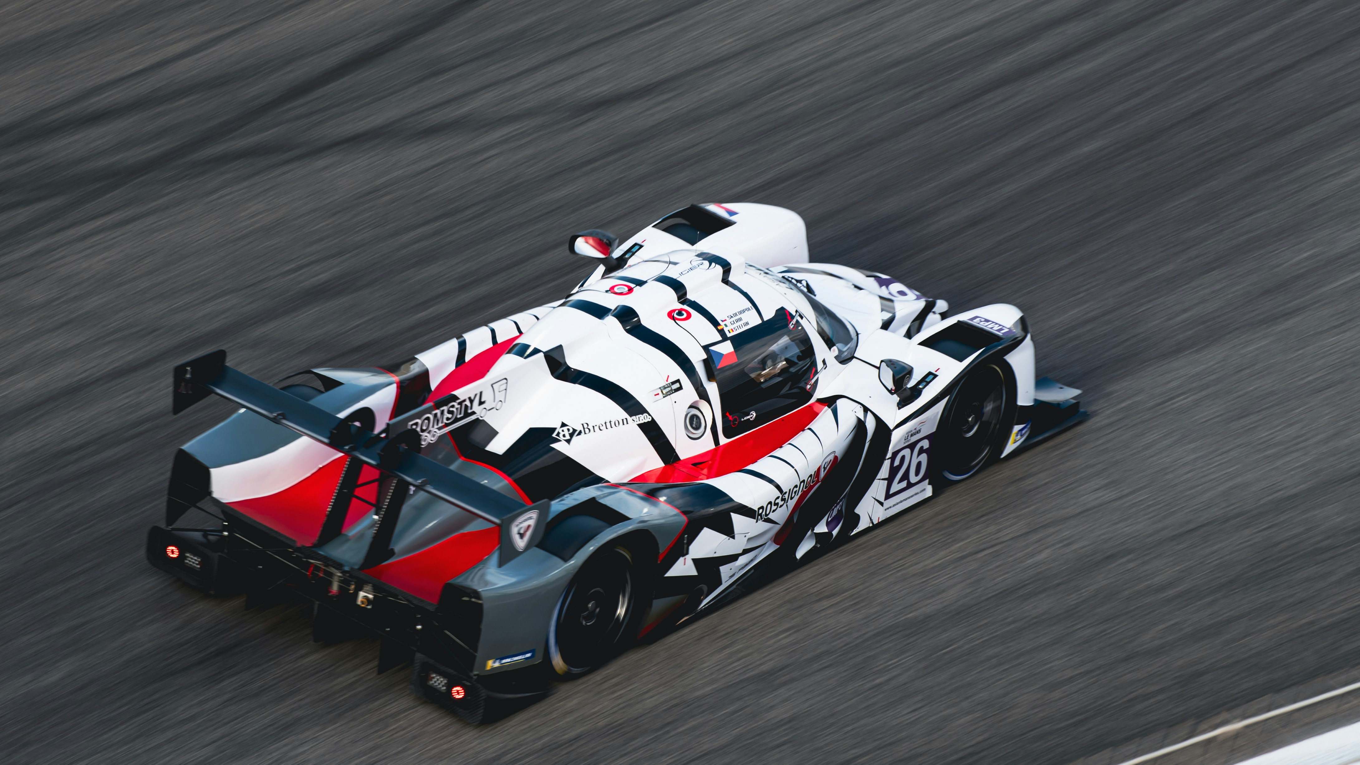 a race car driving down a race track