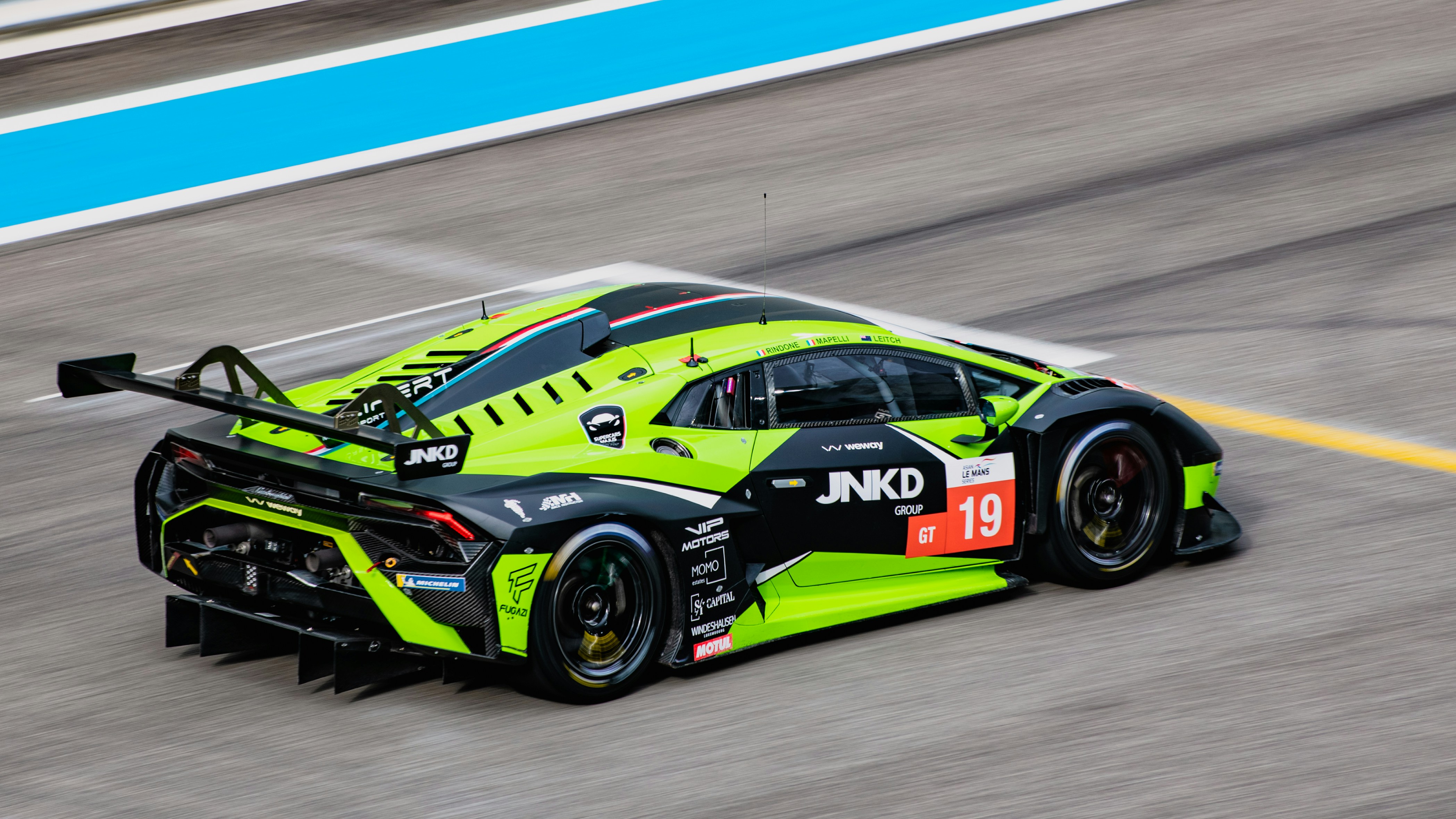 a racing car driving down a race track