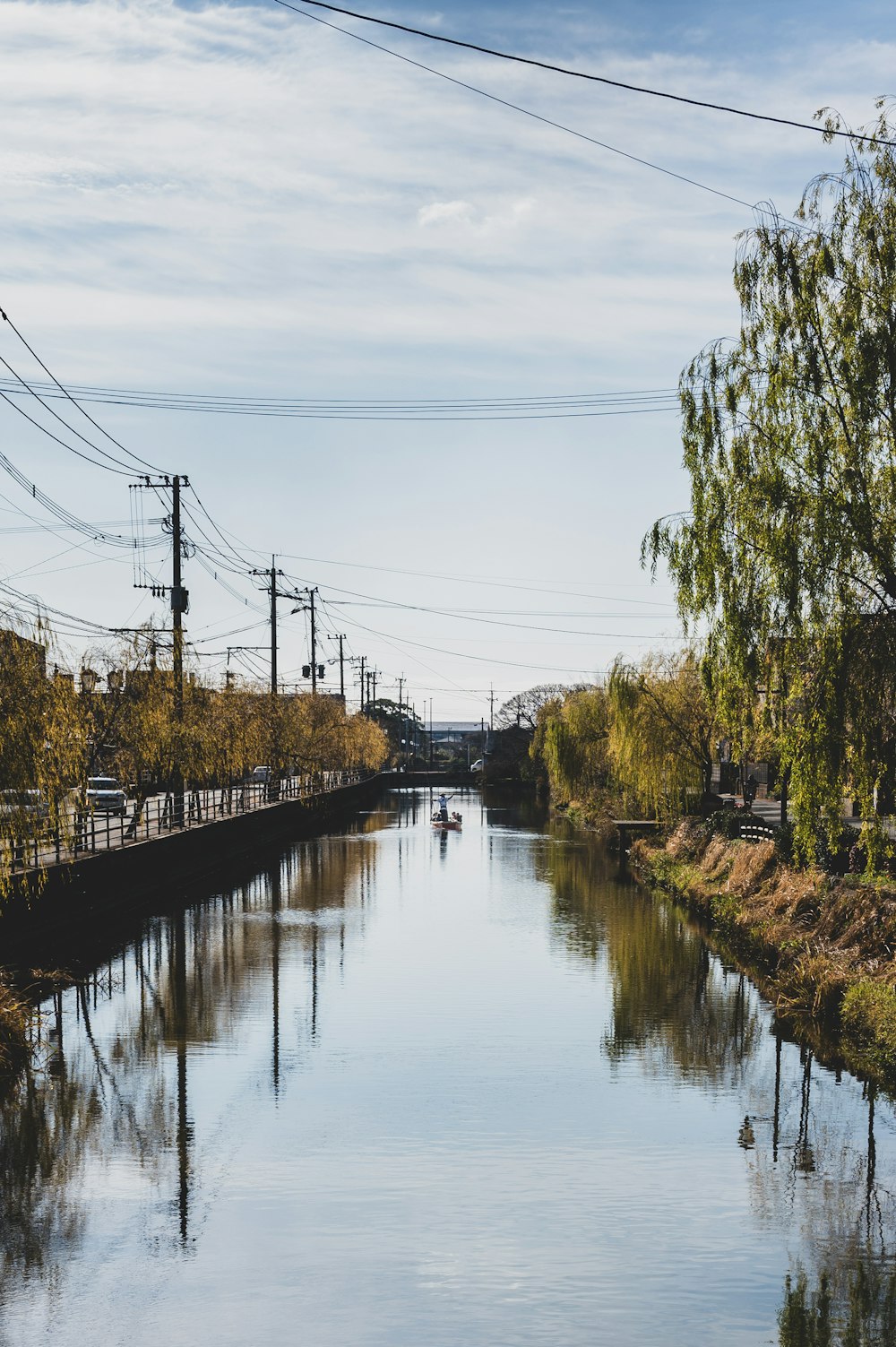 a river running through a lush green countryside