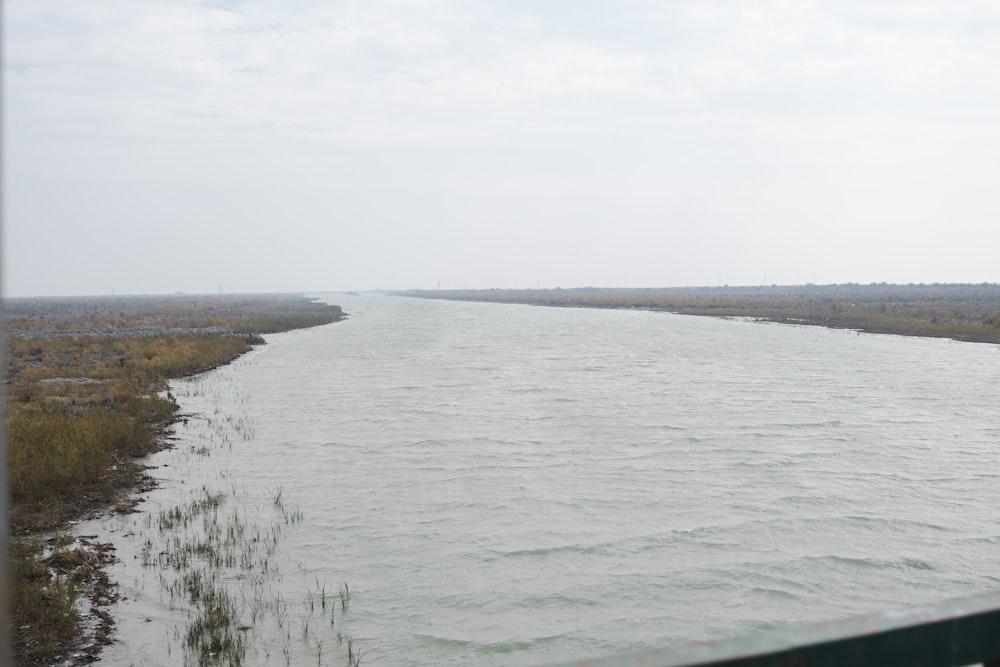 a view of a body of water from a bridge