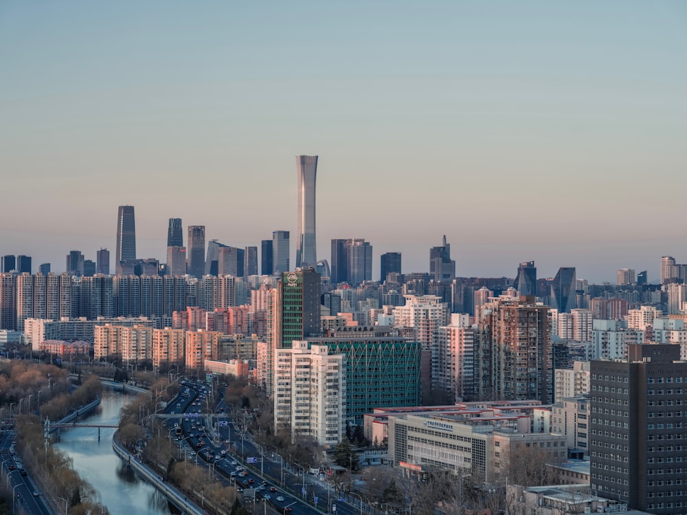 a city skyline with a river running through it