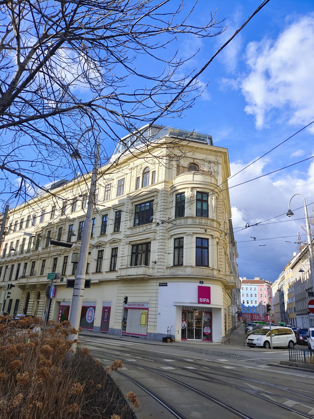 a street corner with a building on the corner