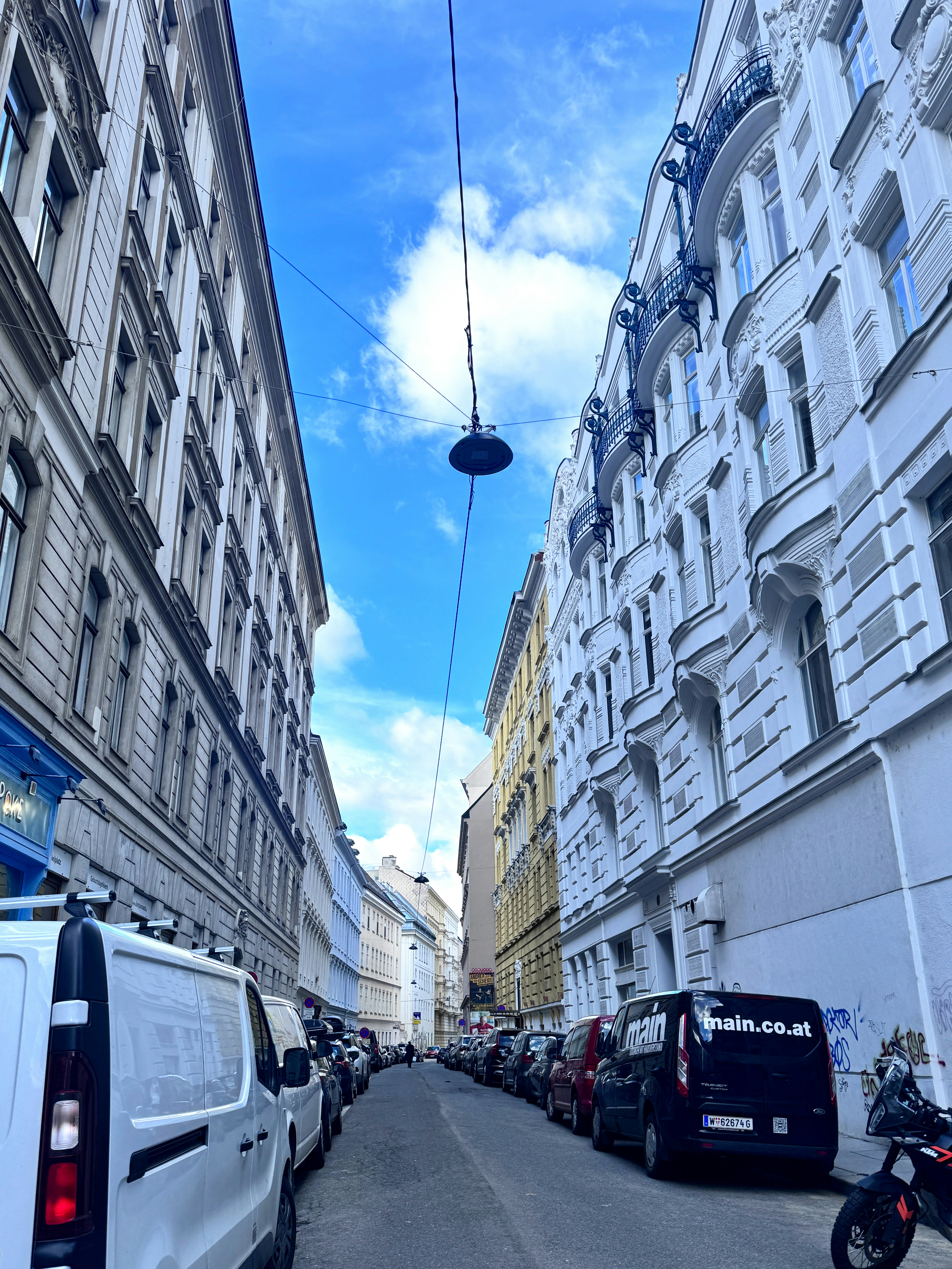 a city street filled with lots of tall buildings