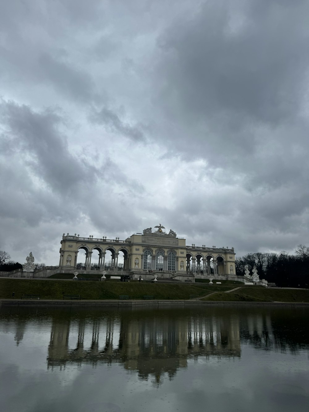 a large building sitting next to a body of water