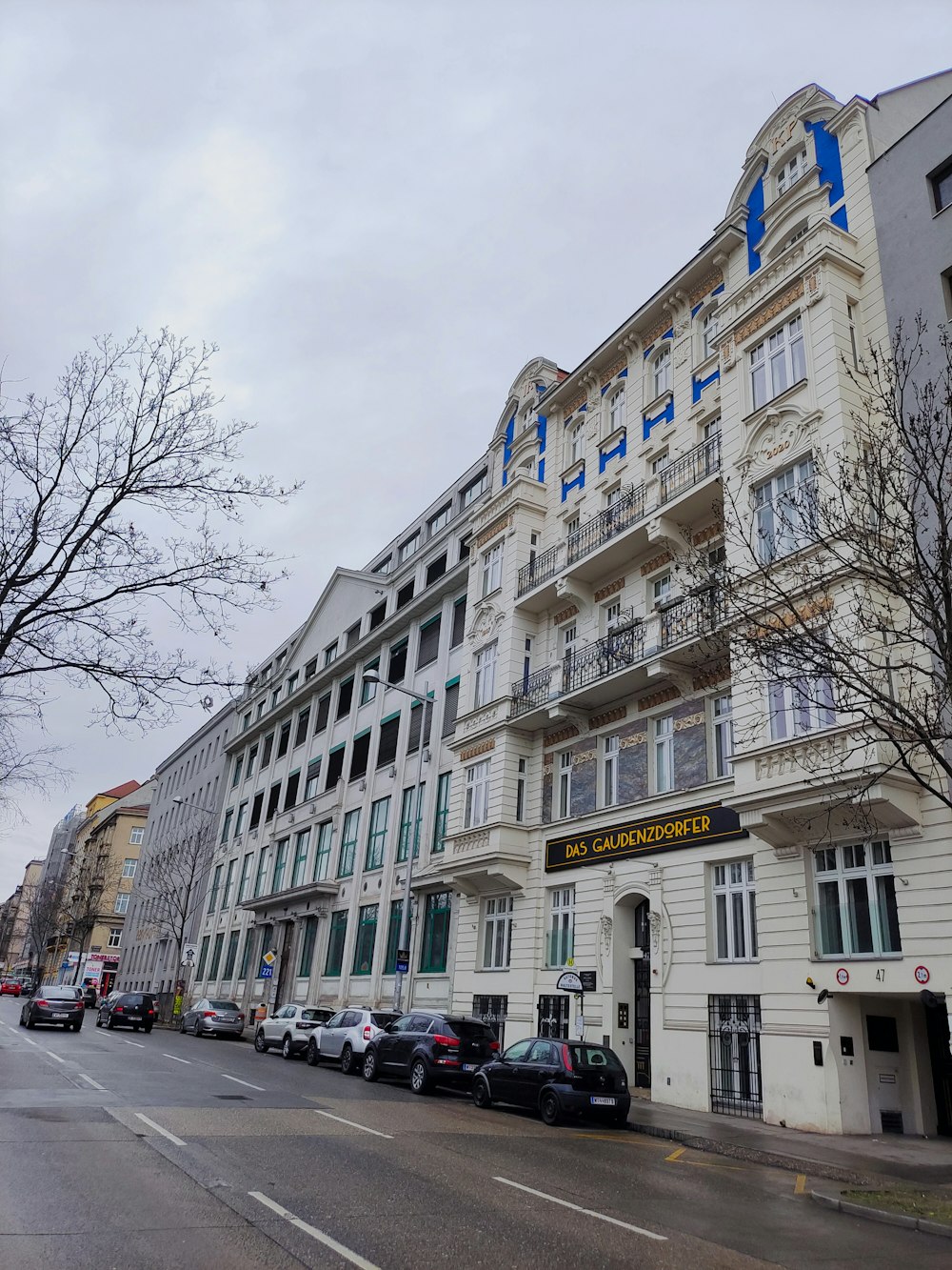 a large white building on a street corner