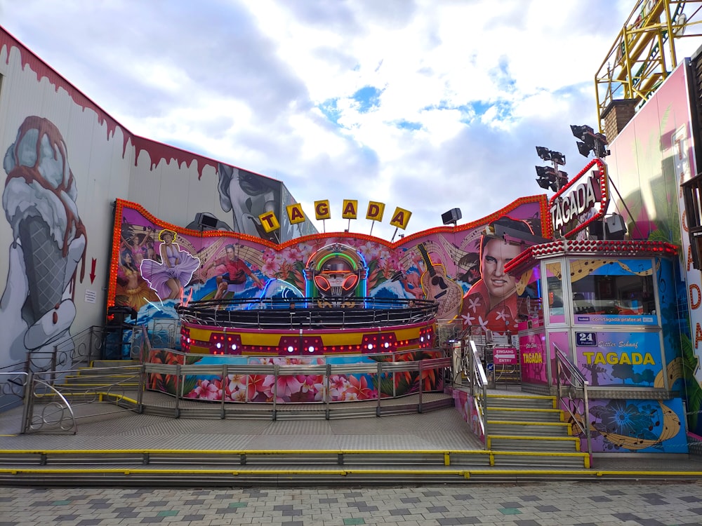 a carnival with a carnival ride and rides