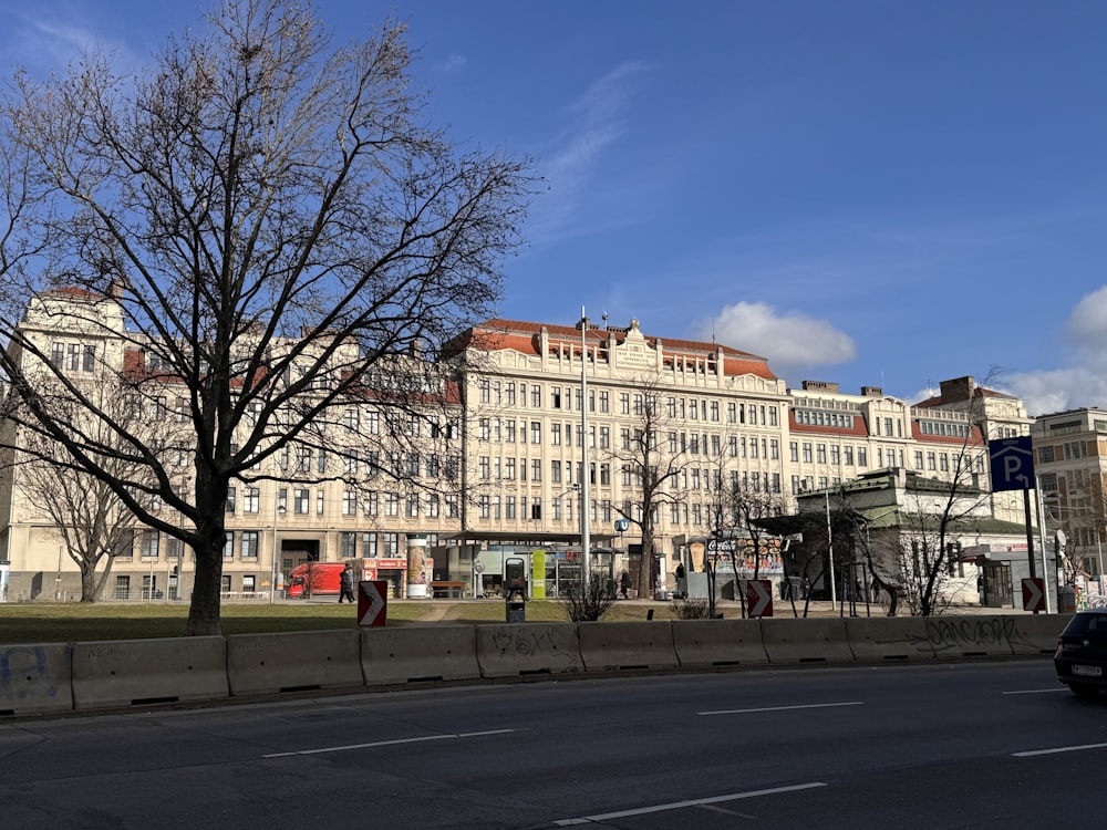 a large white building sitting on the side of a road