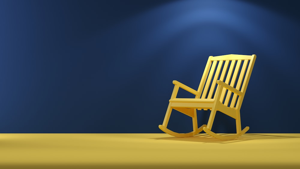 a wooden rocking chair sitting on top of a yellow floor