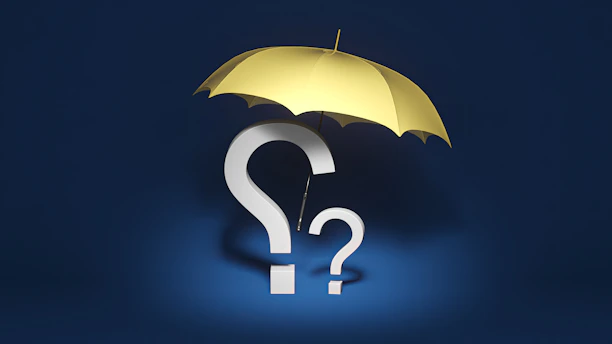 a yellow umbrella with a question mark underneath it