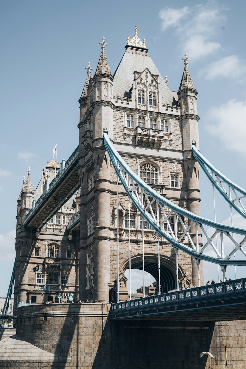 a tall bridge with a very tall tower