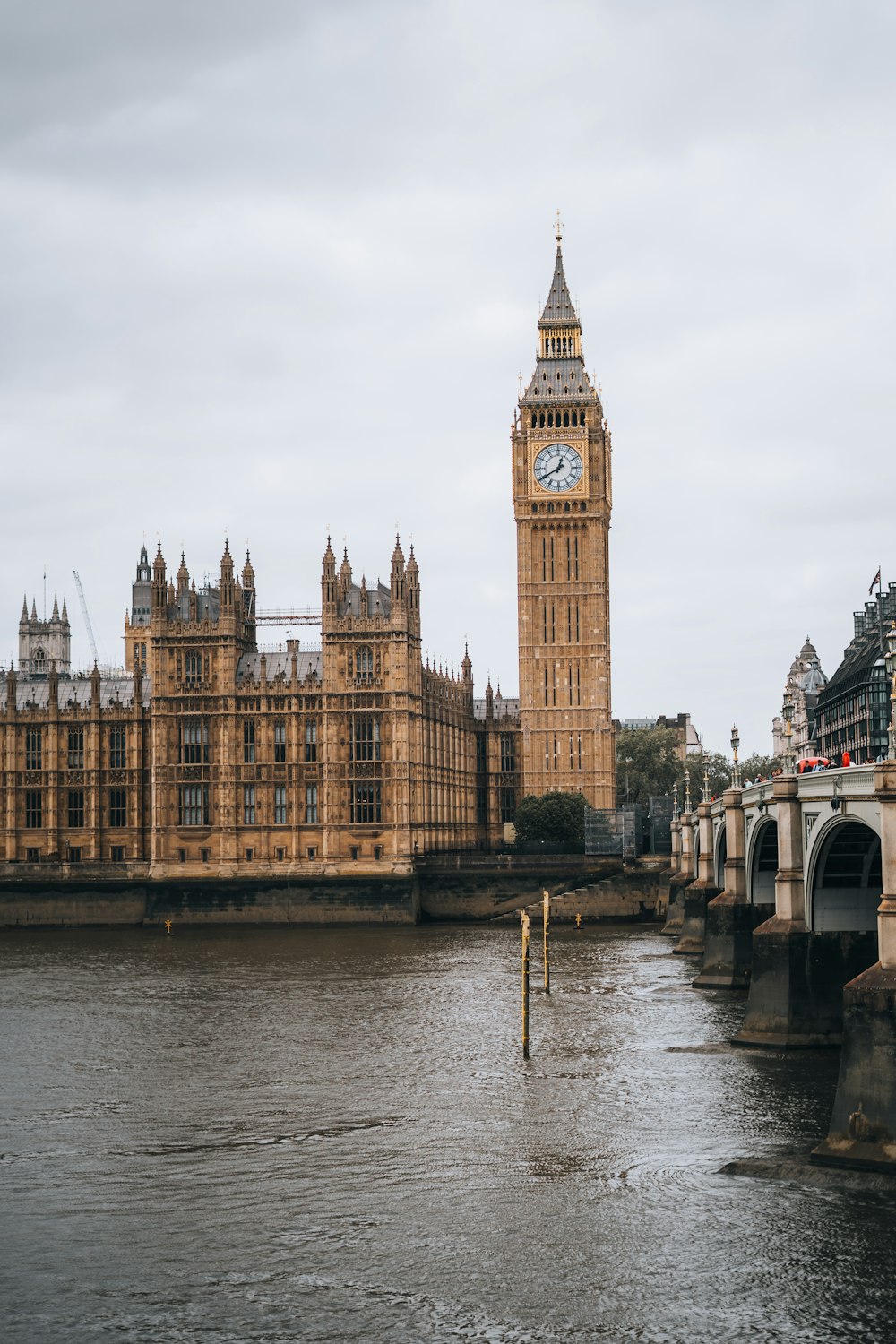 a large clock tower towering over the city of london