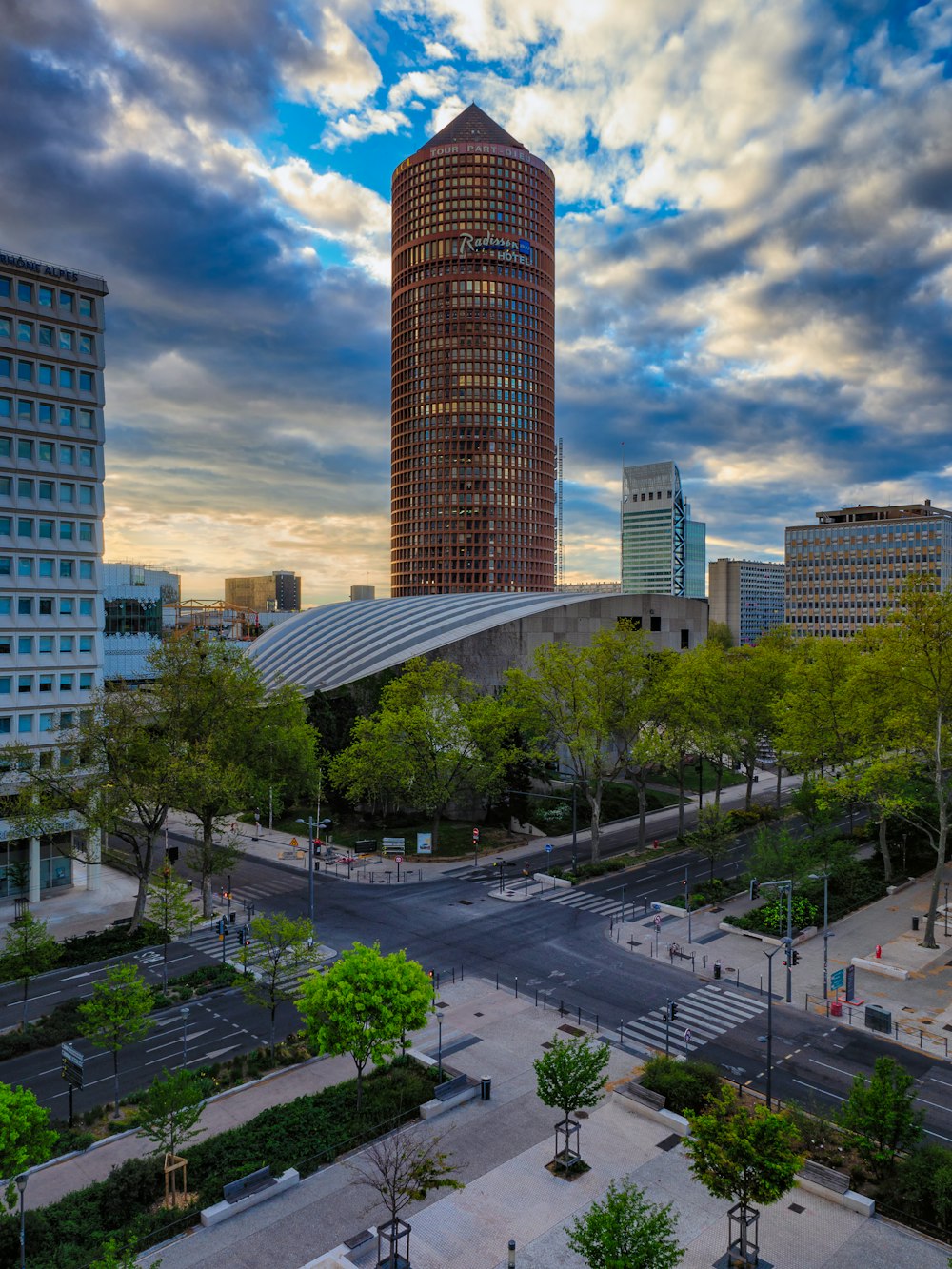 a view of a city with tall buildings and a cloudy sky