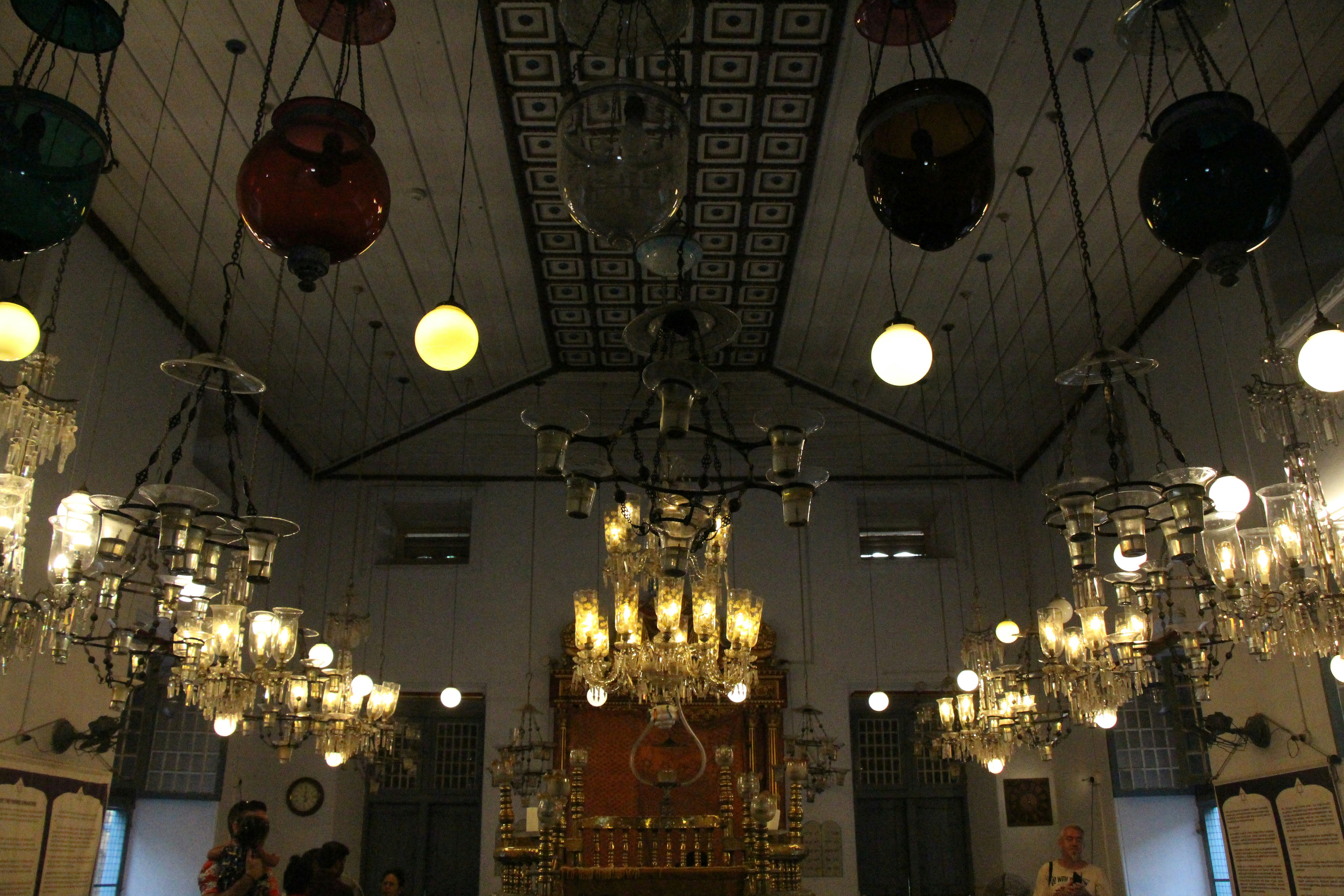 a church with chandeliers hanging from the ceiling