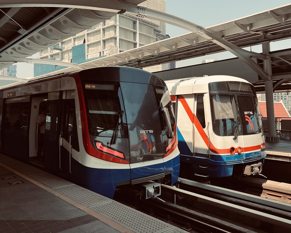 a couple of trains parked next to each other