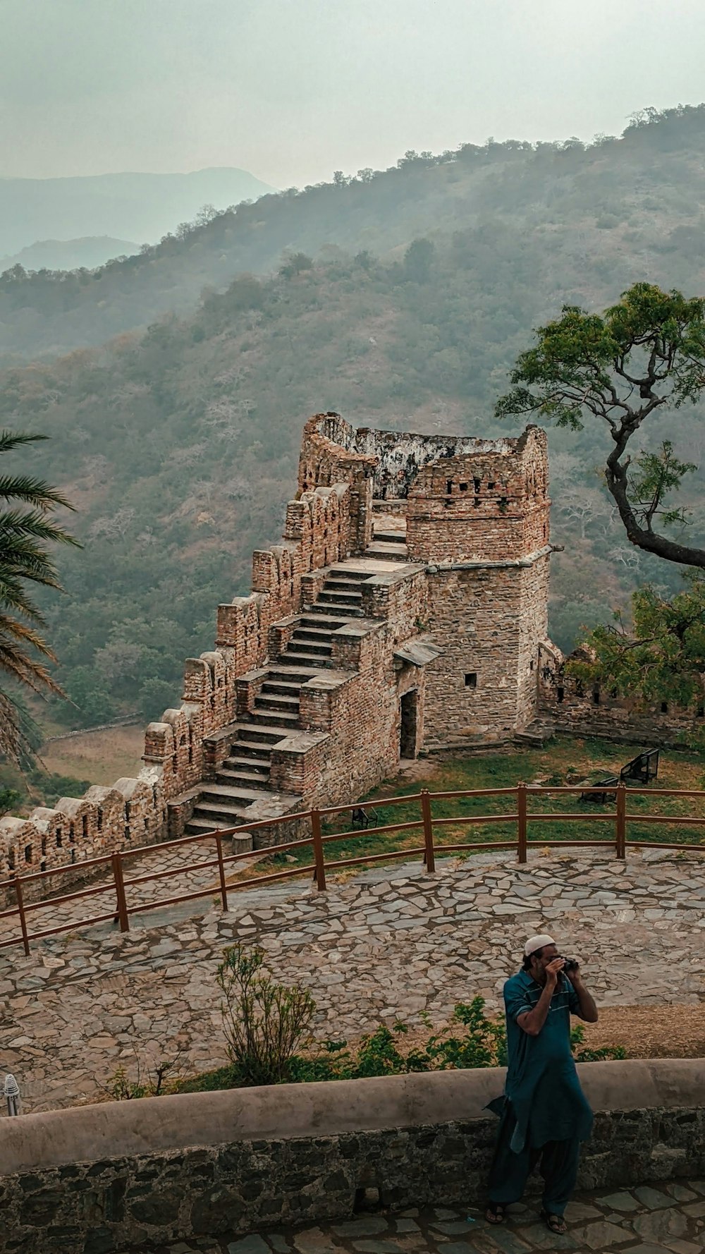 a person taking a picture of a castle