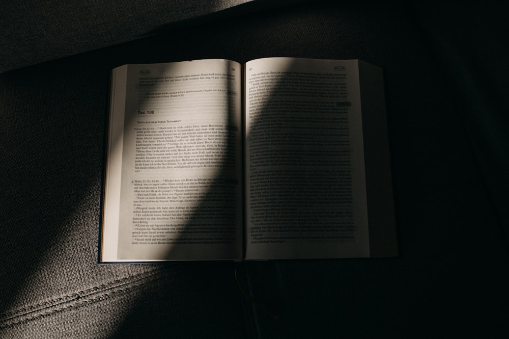 an open book sitting on top of a couch