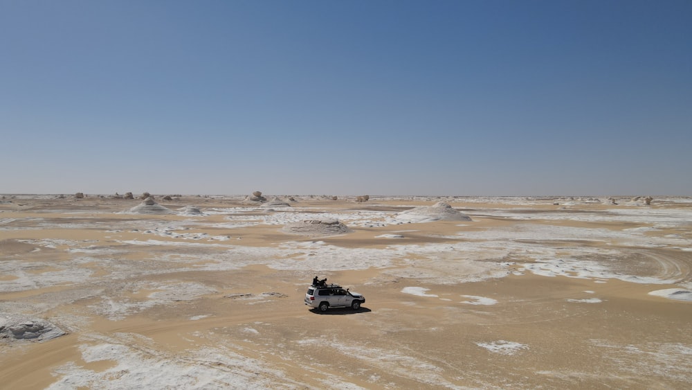 a vehicle is parked in a barren area