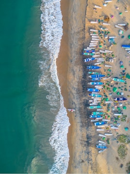 an aerial view of a beach with a bunch of boats