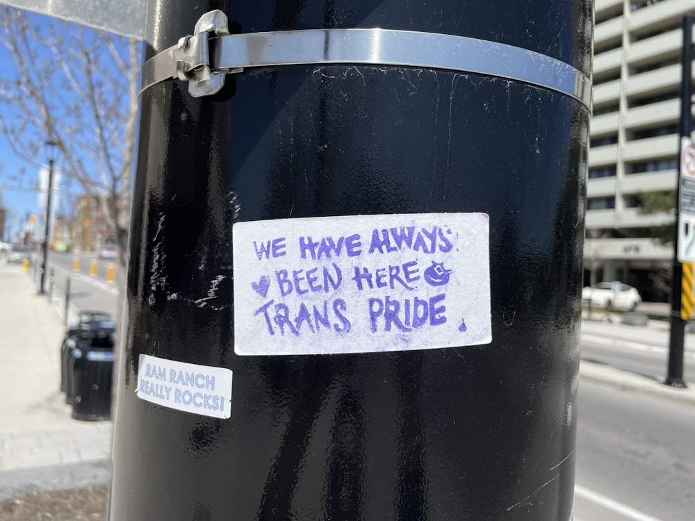 a close up of a pole with a sticker on it