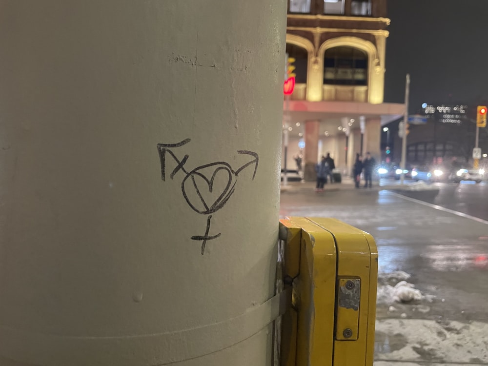 a yellow suitcase sitting on the side of a street