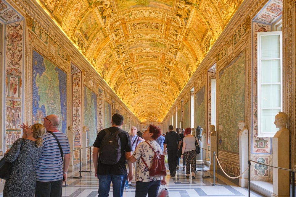 a group of people walking down a hallway