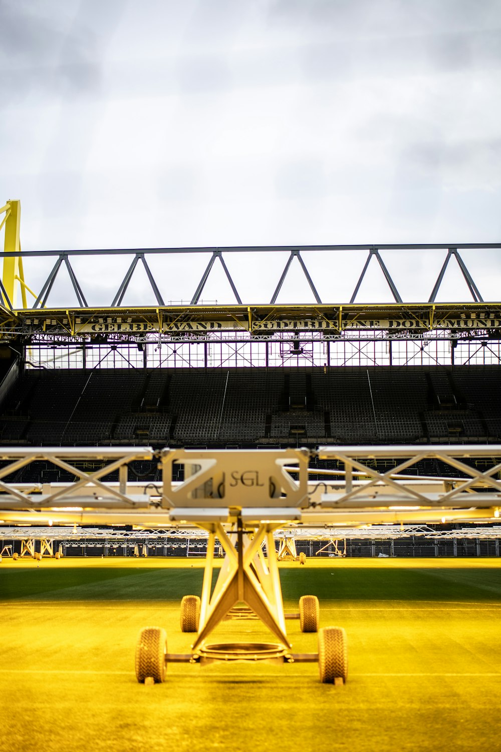 a stadium with a yellow cart in the middle of it