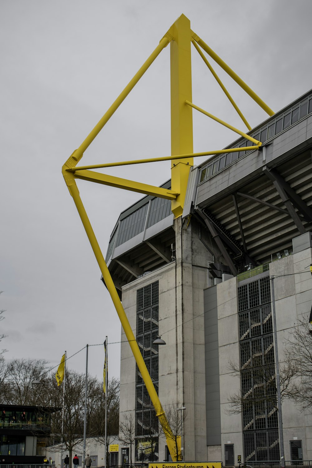 a large metal structure in front of a building