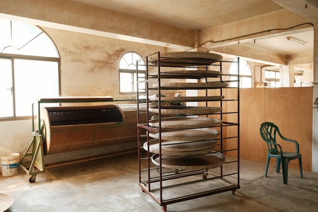 a room with a bunch of pans on a rack