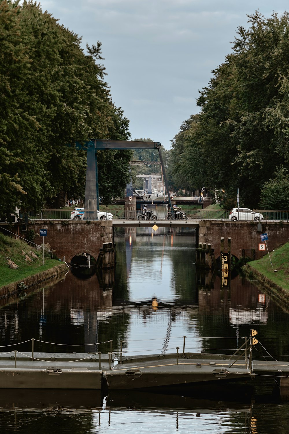 a boat is docked at the end of a canal