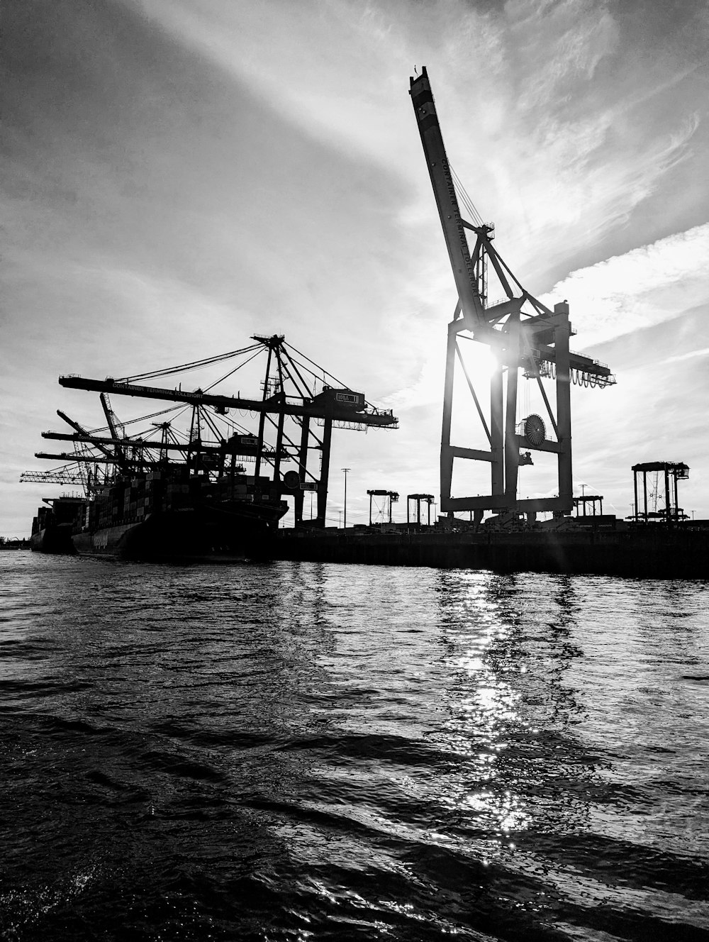 a black and white photo of a boat in the water