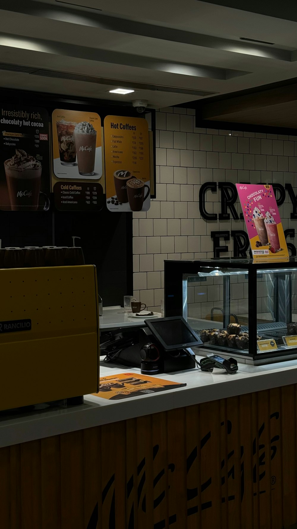 a counter with a variety of desserts on it