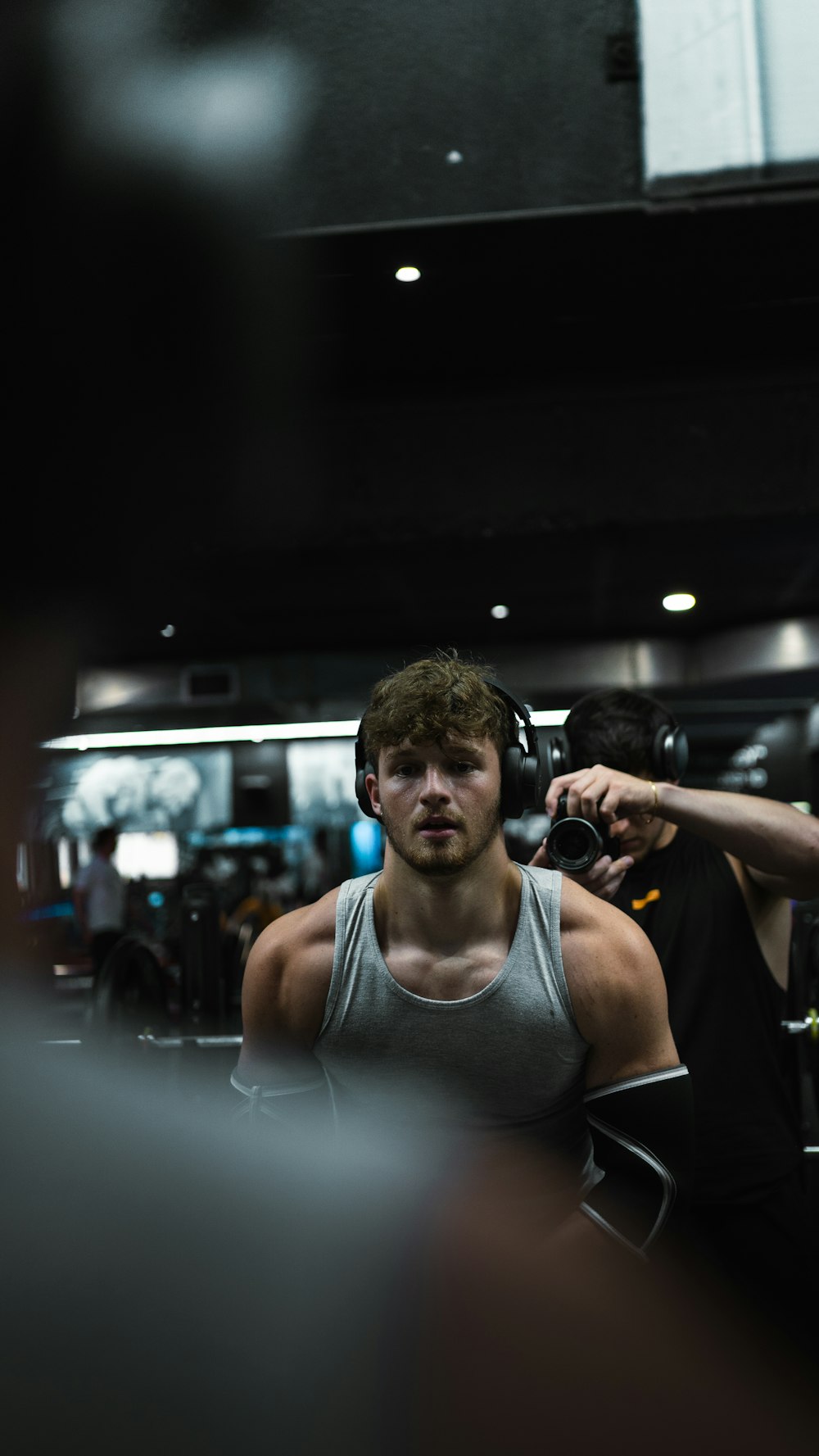 a man is getting his hair done in a gym