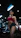 a woman in a red top and green skirt in a gym