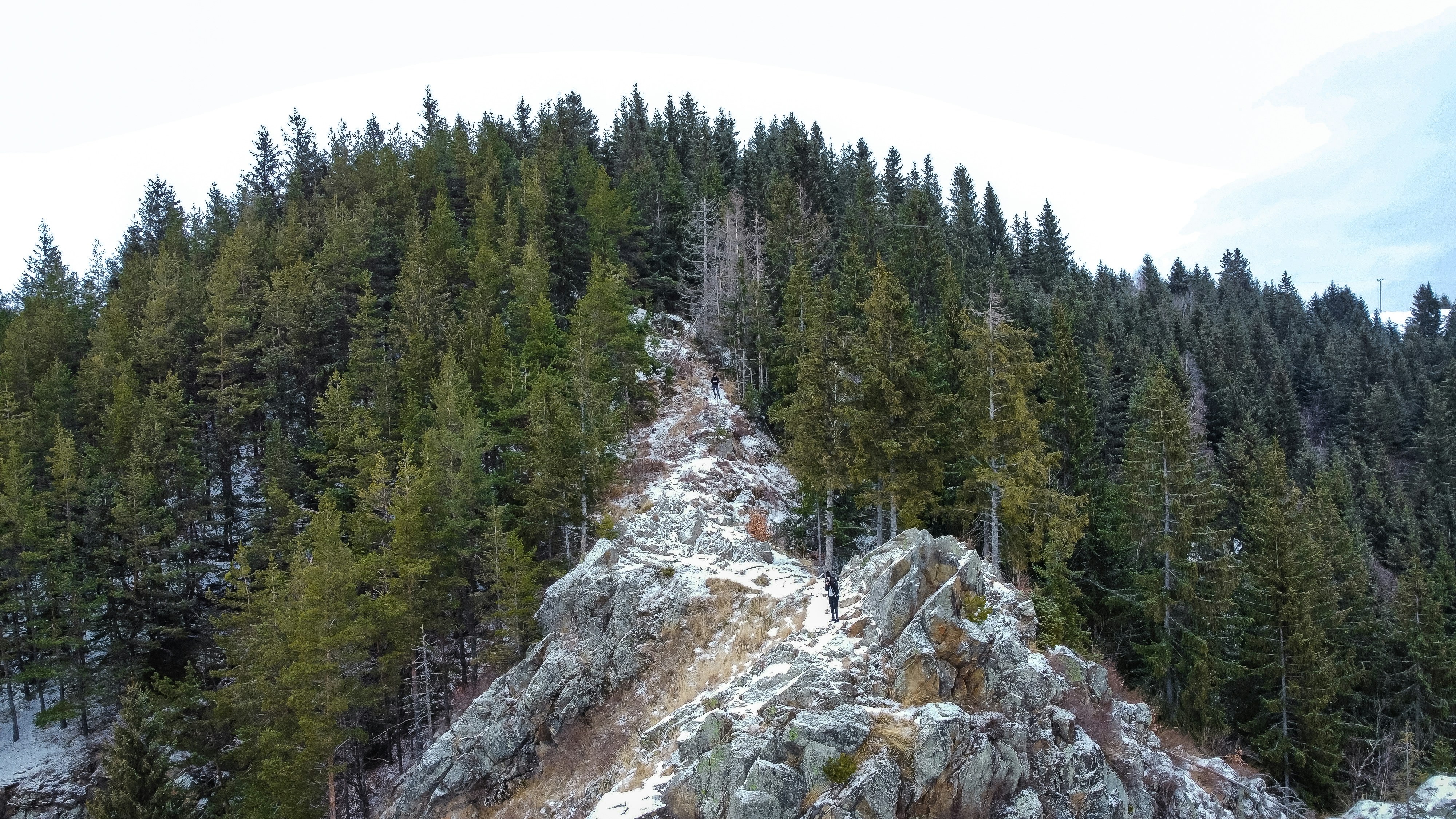 a person standing on top of a snow covered mountain