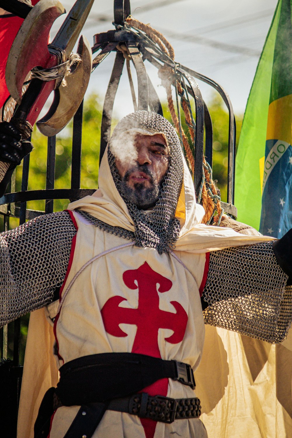 a man dressed as a knight holding a sword